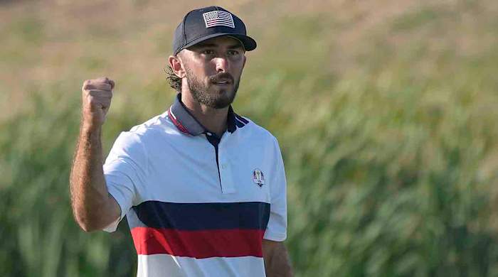 Max Homa celebrates after winning his afternoon fourballs match 2 and 1 at the 2023 Ryder Cup